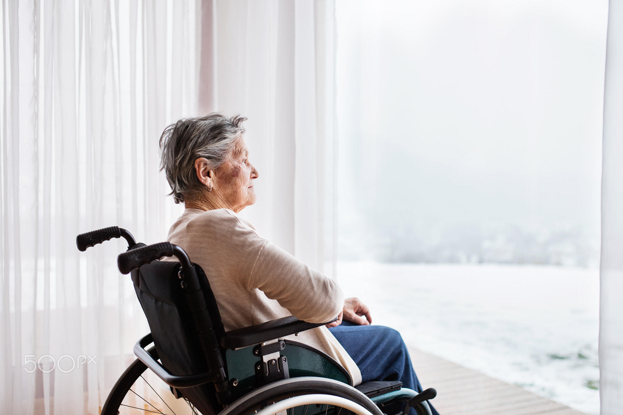 Senior woman in wheelchair at home.