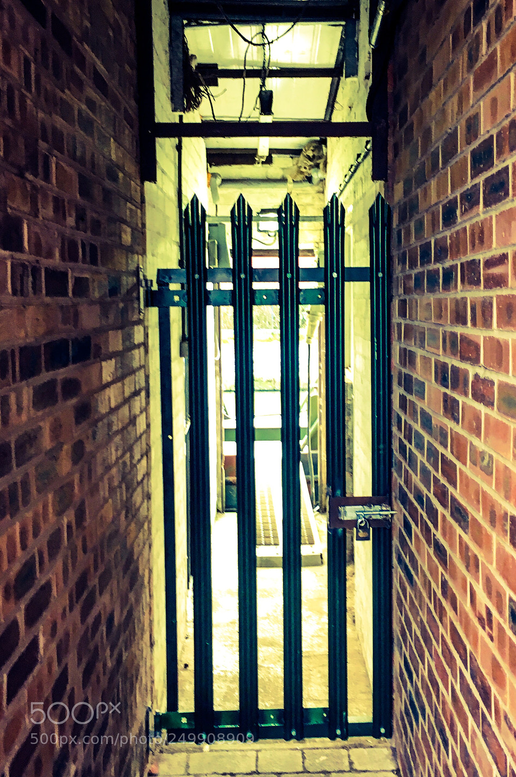Apple iPhone 6s sample photo. Metal gate and brick photography