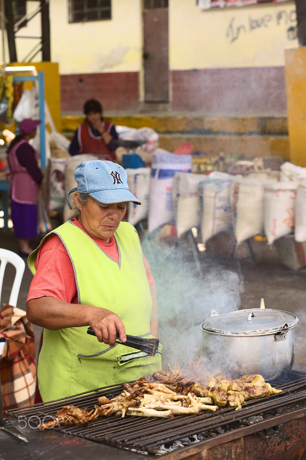 Canon EOS 5D Mark II + Canon EF 85mm F1.8 USM sample photo. Barbecuing chicken legs in banos, ecuador photography