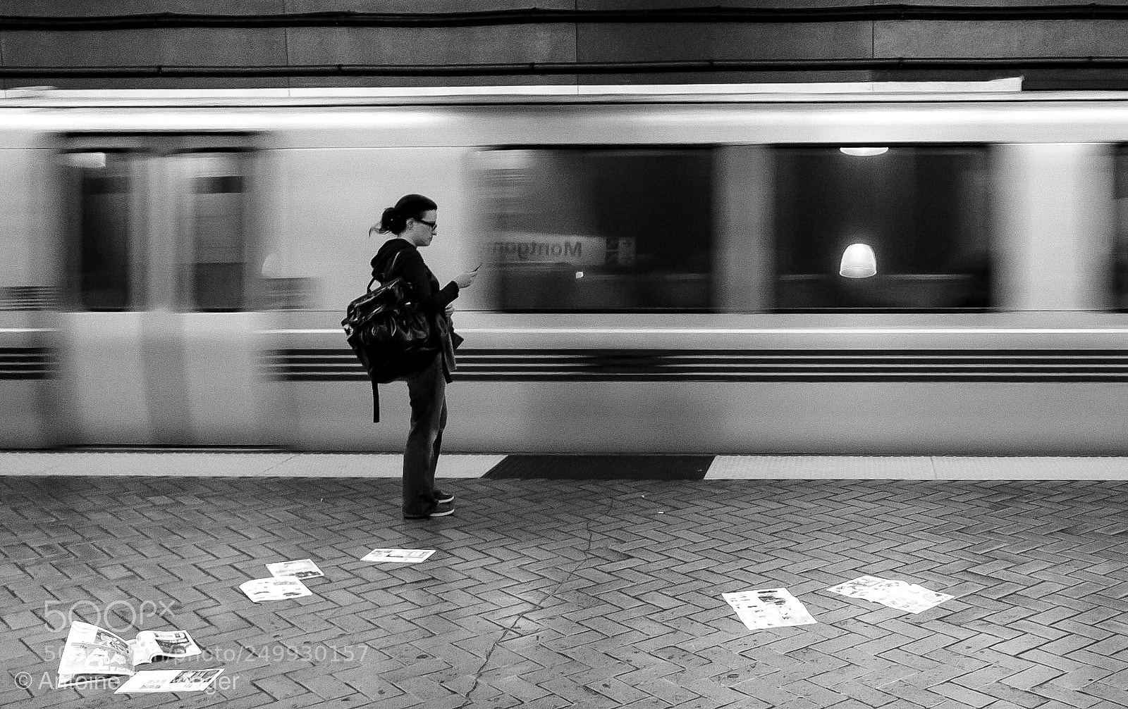 Fujifilm X70 sample photo. Woman with newspapers photography