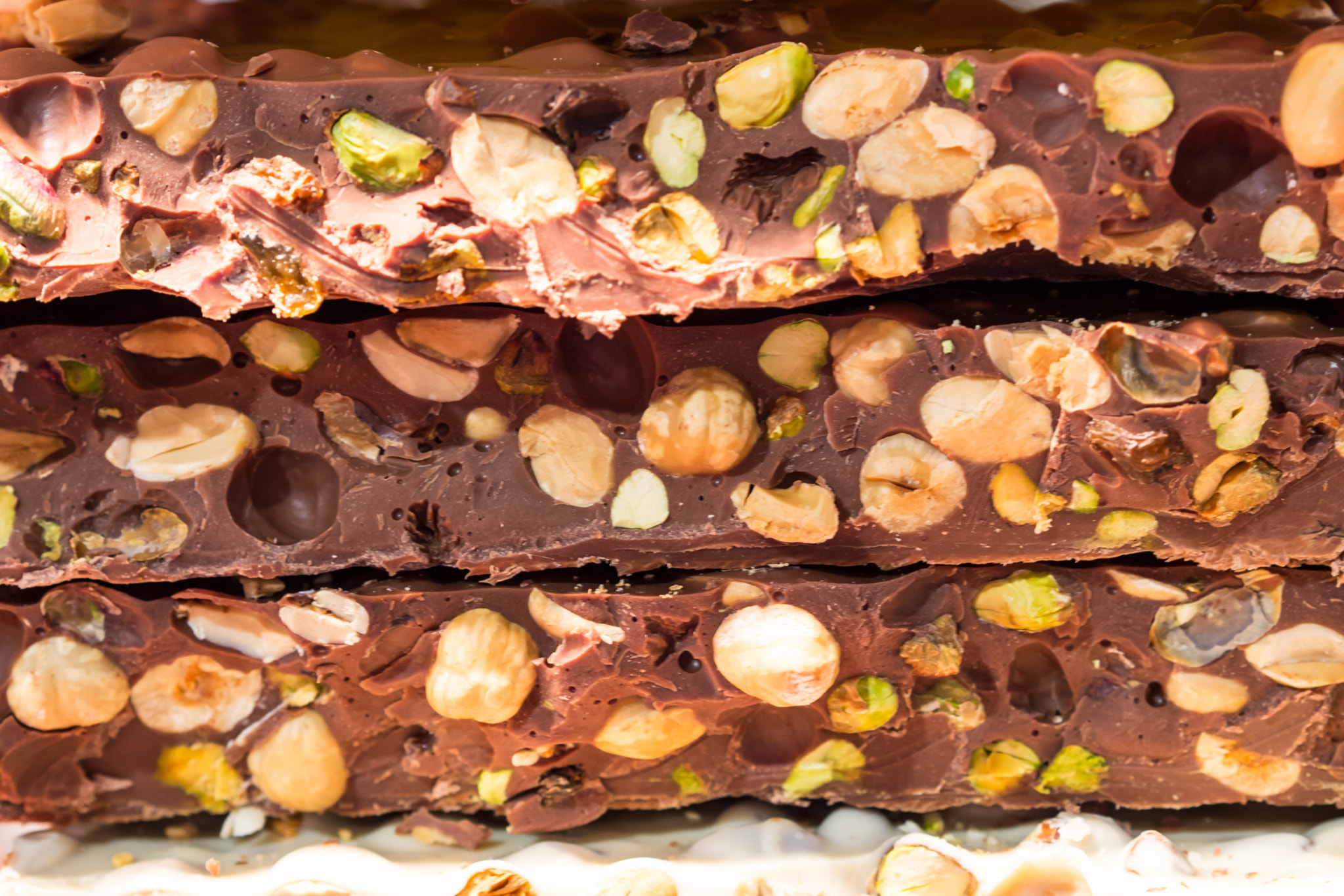 Olympus PEN E-PM2 sample photo. Chocolate with peanuts photography