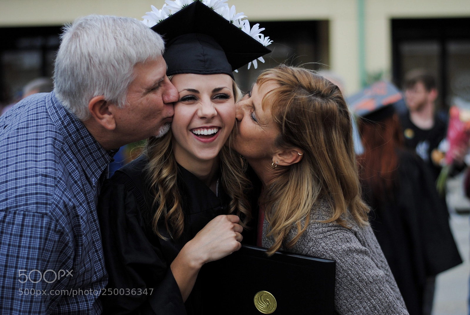 Nikon D3000 sample photo. Graduation kisses photography