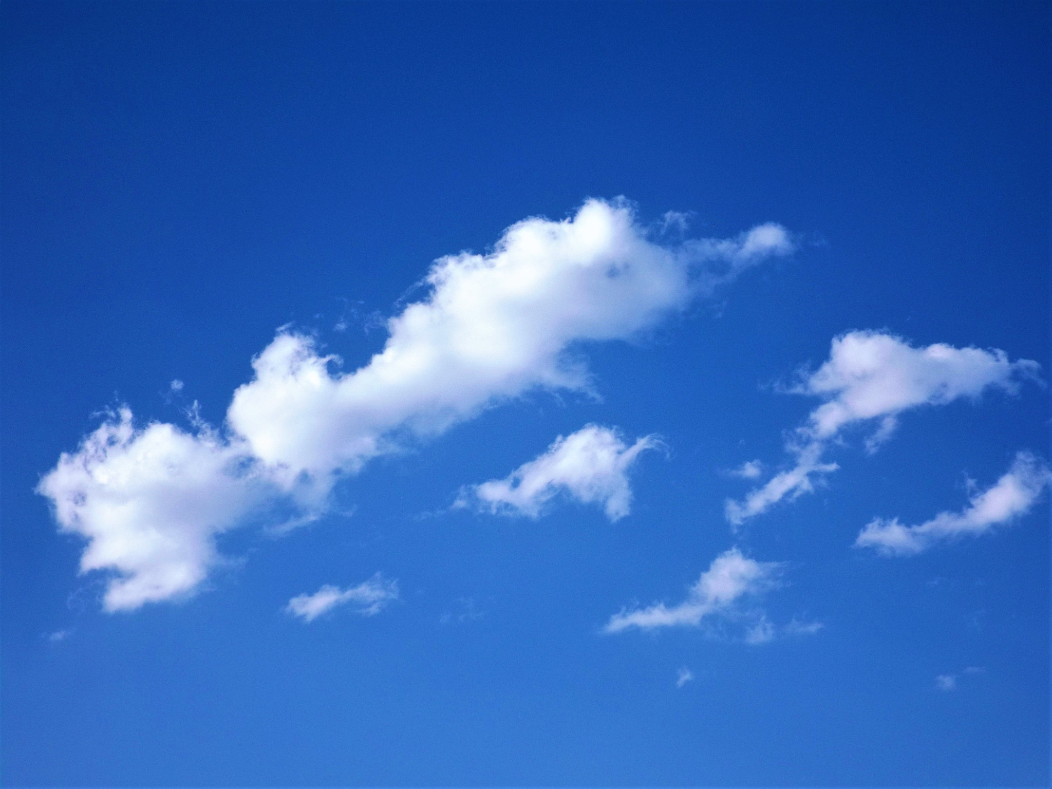 Fujifilm FinePix S4800 sample photo. A few clouds in a deep blue sky photography