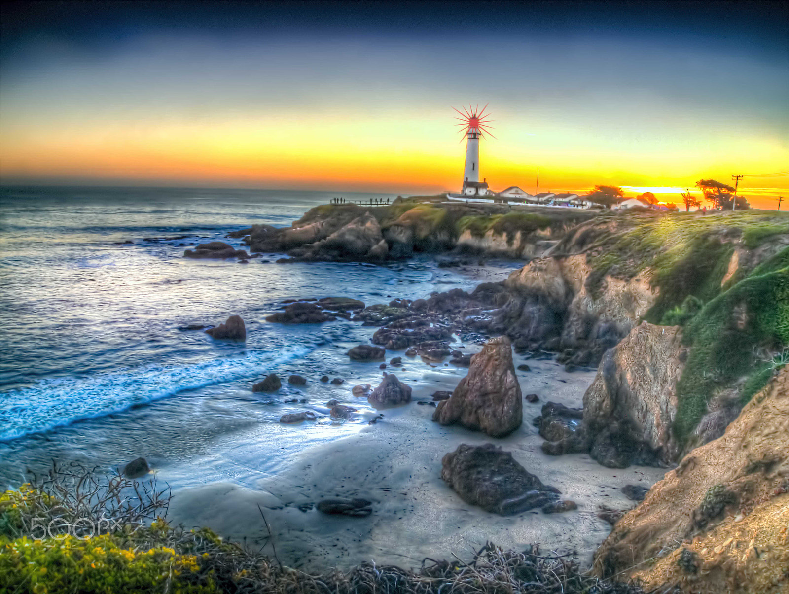 Olympus PEN E-PL1 sample photo. Pigeon cove lighthouse at sunset with rocks photography