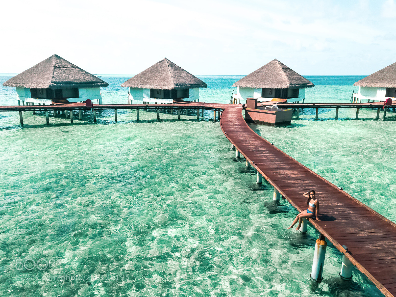 DJI FC220 sample photo. Woman in bikini seating photography