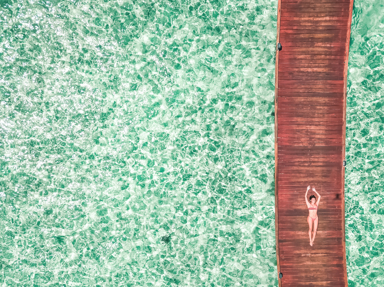 DJI FC220 sample photo. Woman in bikini laying photography