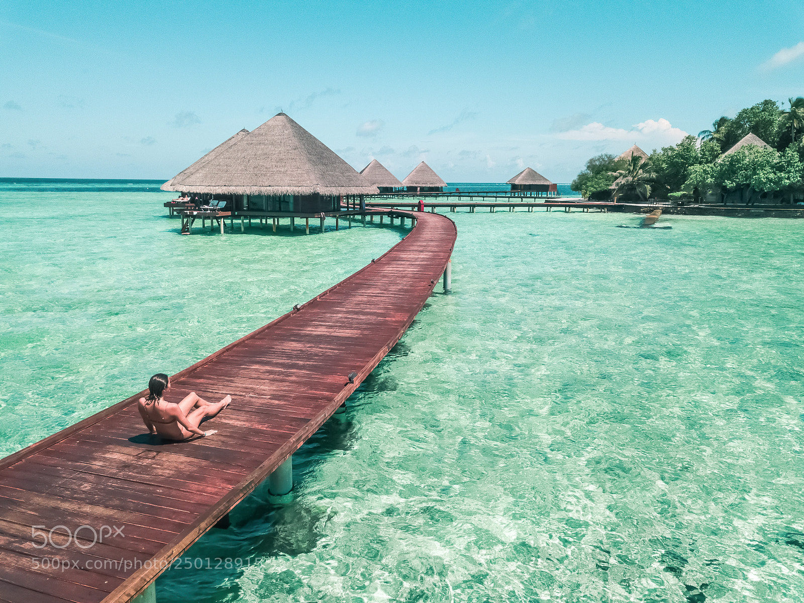 DJI FC220 sample photo. Woman in bikini seating photography