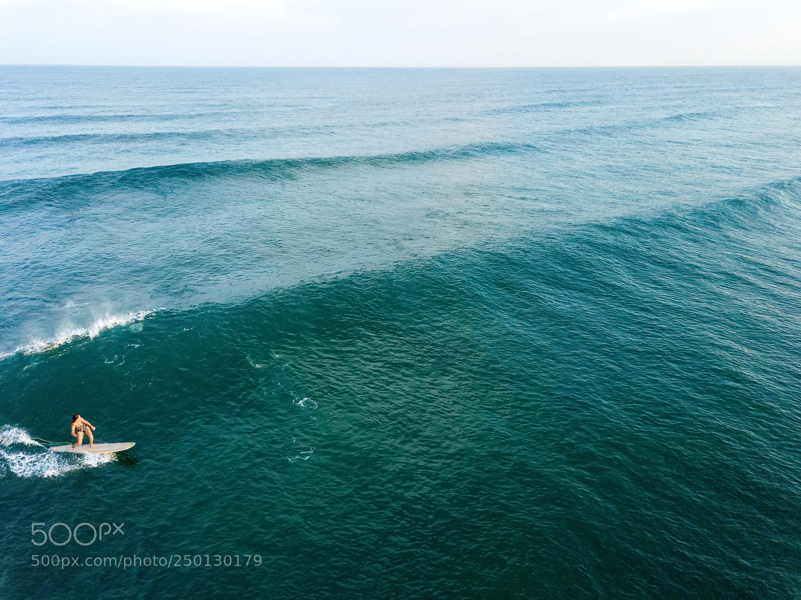 DJI FC220 sample photo. Woman surfing alone photography