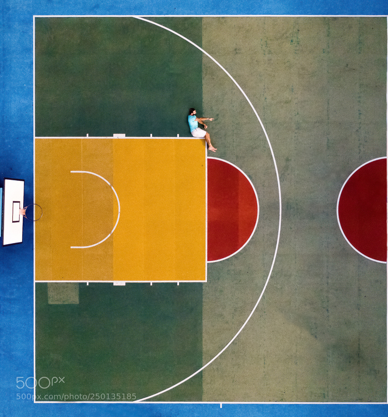 DJI FC220 sample photo. Man sitting on basketball photography