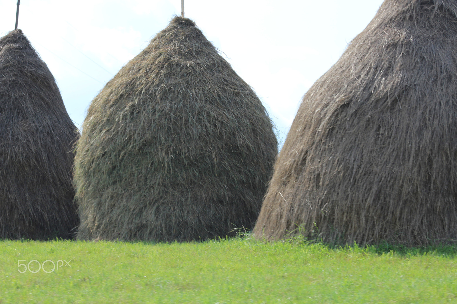 Canon EF 75-300mm f/4-5.6 sample photo. European hay stacks photography