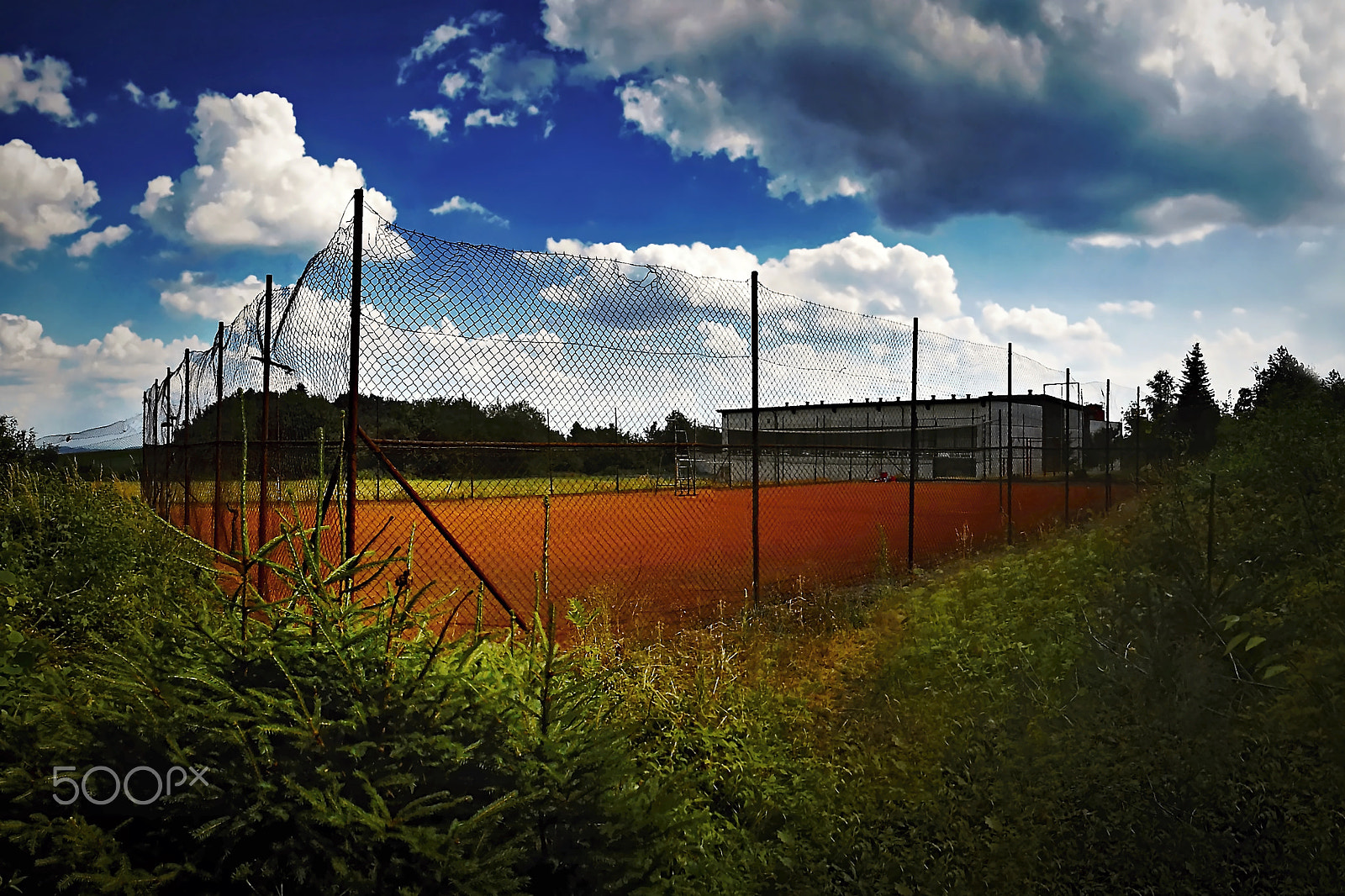 Nikon Coolpix S3300 sample photo. Red tennis court in czech city of primda during sunny summer holiday 2015 with dark coloration photography