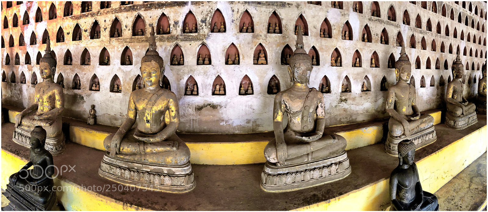 Apple iPhone X sample photo. Buddah images line the photography