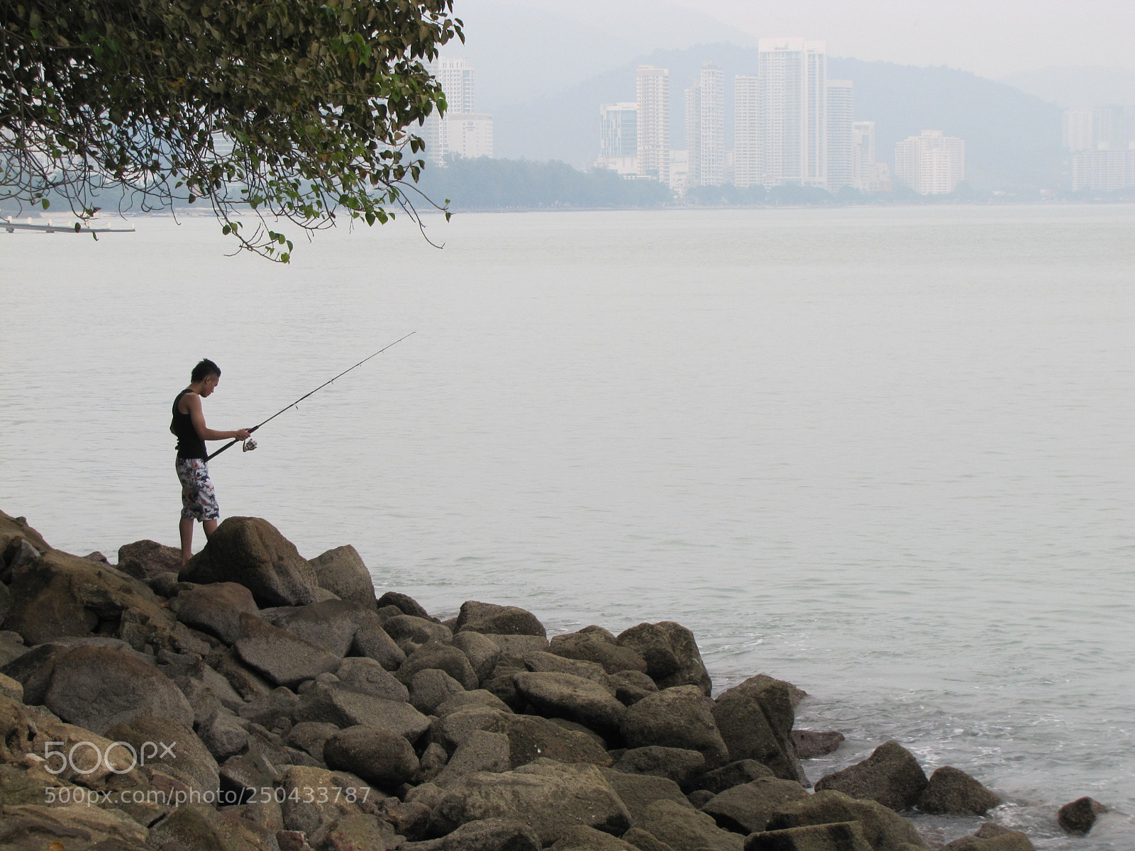 Canon PowerShot SX20 IS sample photo. Fishing at seaside alone photography
