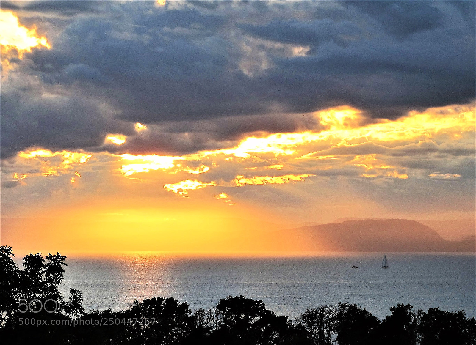 Canon PowerShot G12 sample photo. Dramatic skies catches boats photography