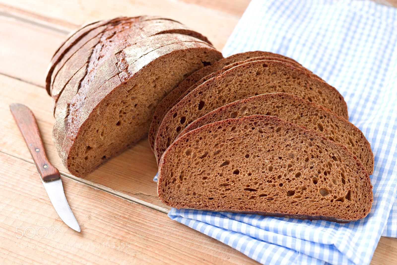 Canon EOS 5D Mark II sample photo. Sliced dark bread photography