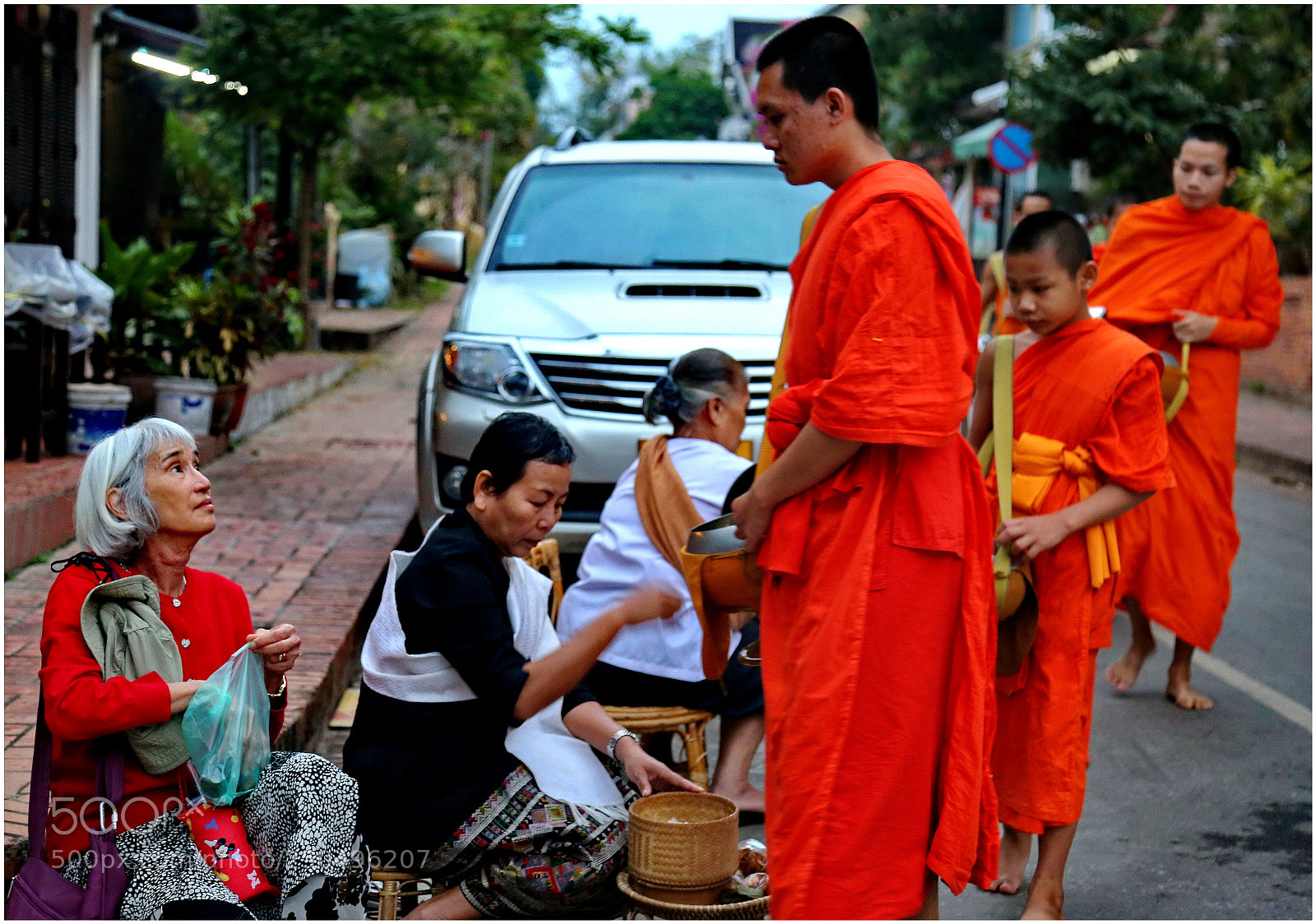 Canon EOS 6D + Canon EF 24-105mm F4L IS USM sample photo. Monks acepting rice offerings photography