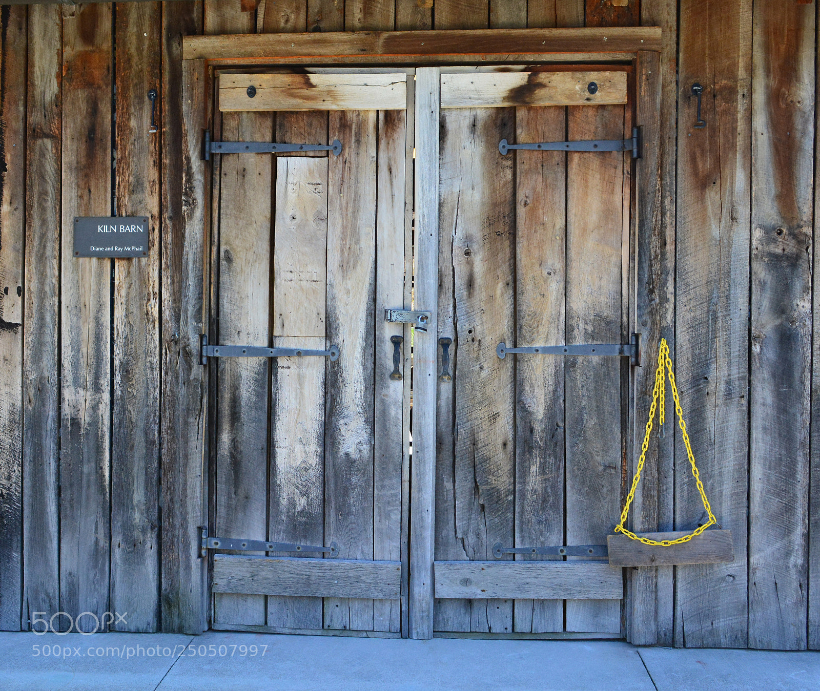 Nikon D5200 sample photo. Yellow chain and doors photography