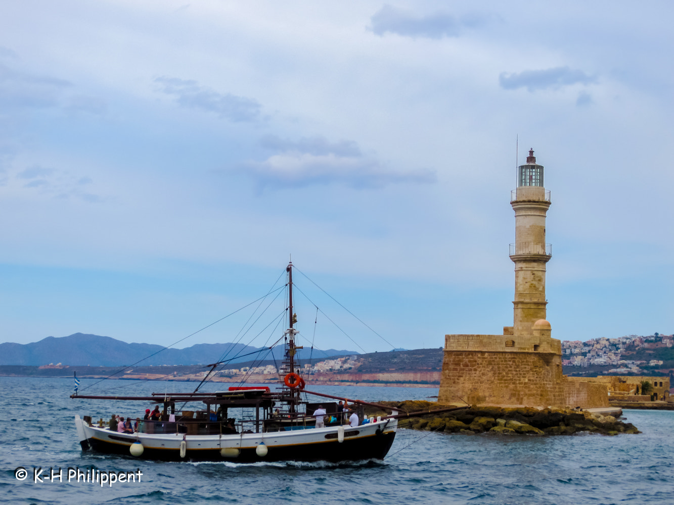 Canon PowerShot ELPH 300 HS (IXUS 220 HS / IXY 410F) sample photo. Chania (crete, greece), the lighthouse in the harbor entranceder photography