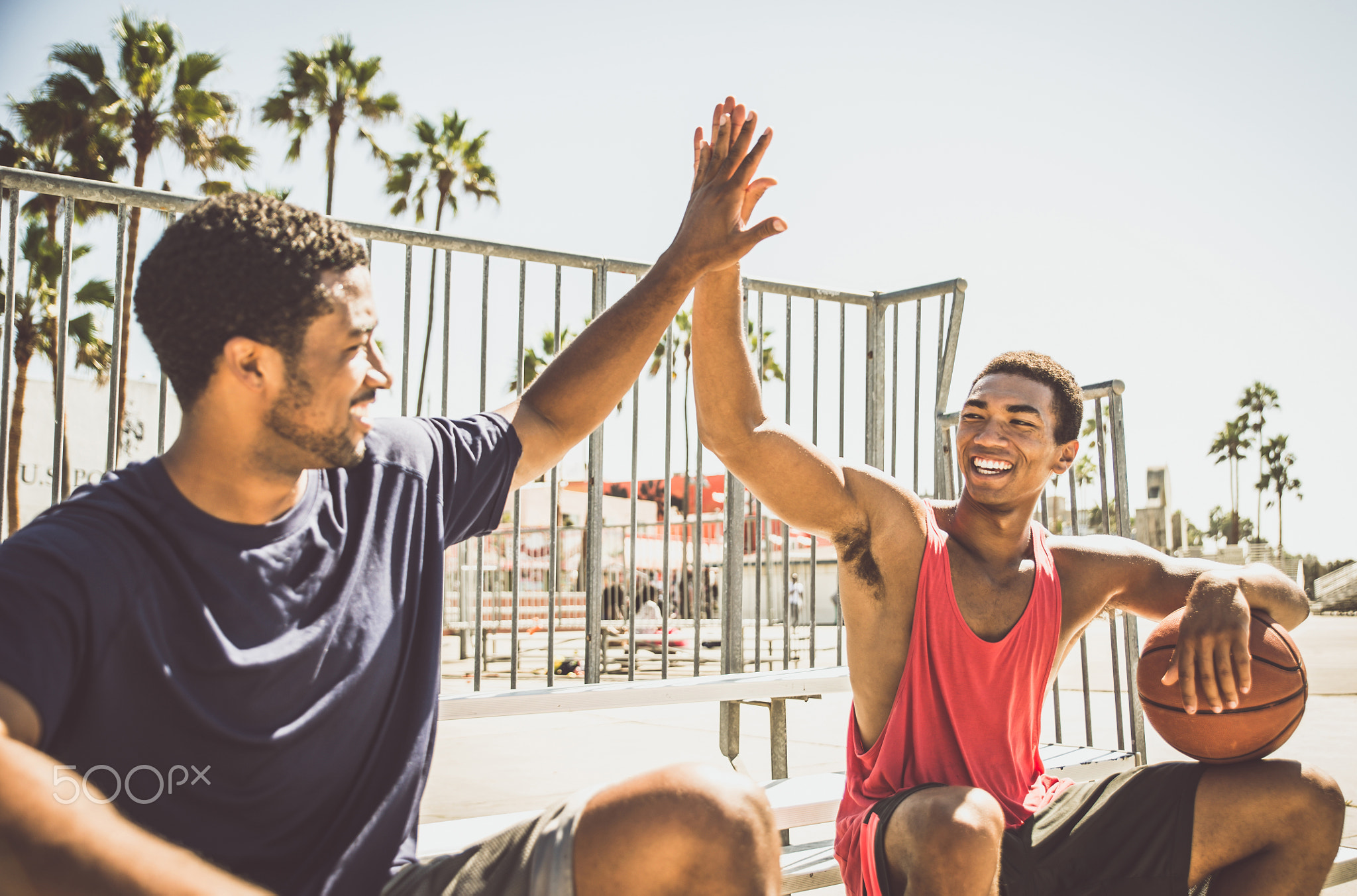 Two basketball players playing outdoor in LA