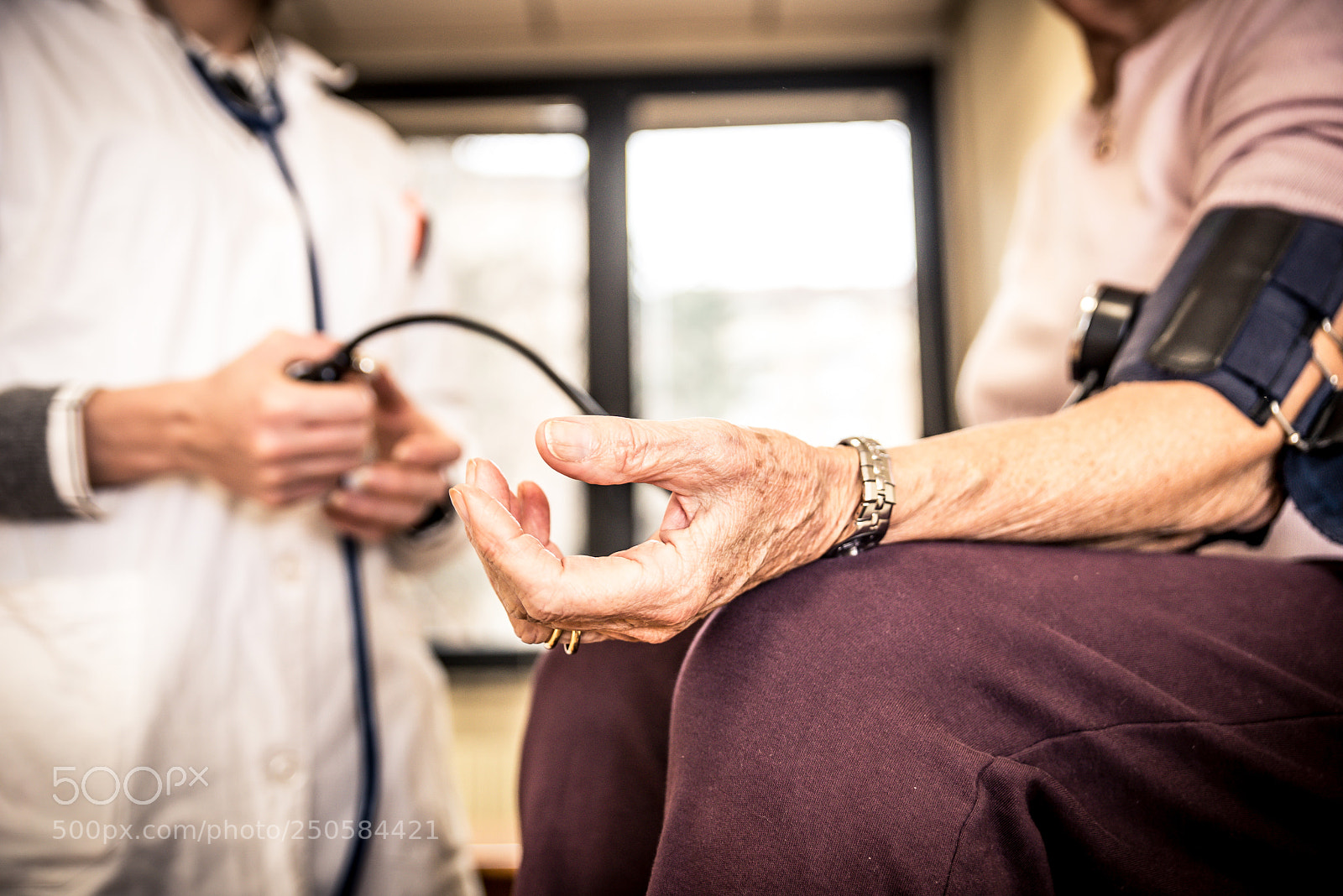 Nikon D610 sample photo. Nurse assisting patient in photography