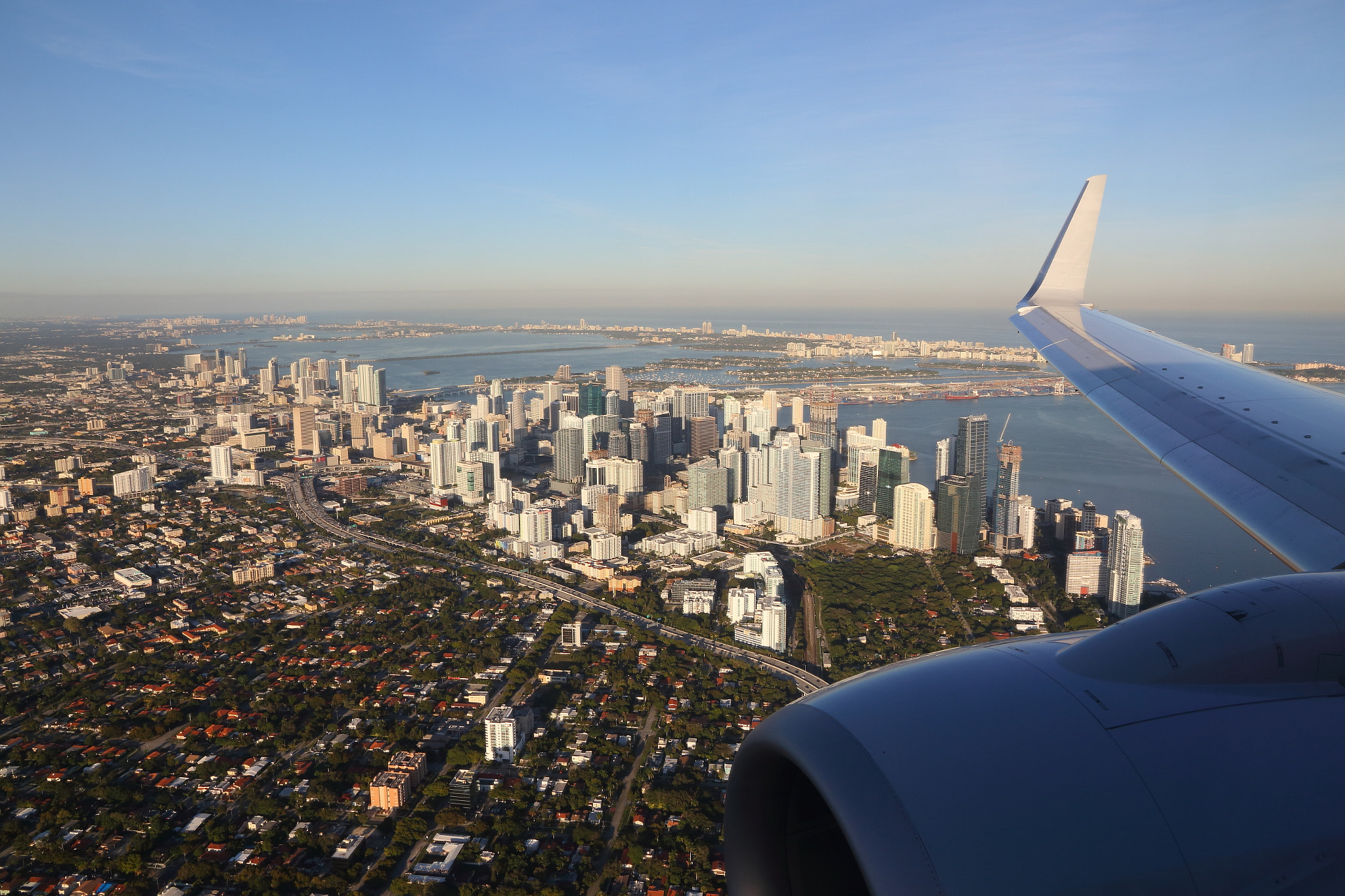 Canon EOS 70D + Canon EF-S 15-85mm F3.5-5.6 IS USM sample photo. Final approach over downtown miami photography