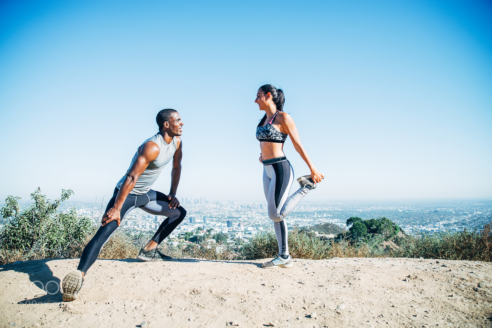 Nikon D610 sample photo. Runners doing stretching photography
