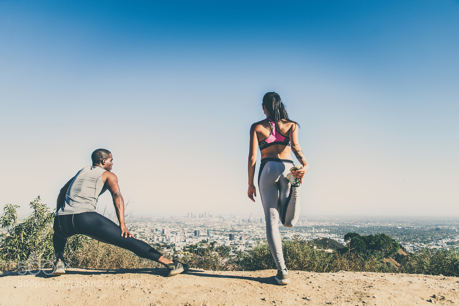 Nikon D610 sample photo. Runners doing stretching photography
