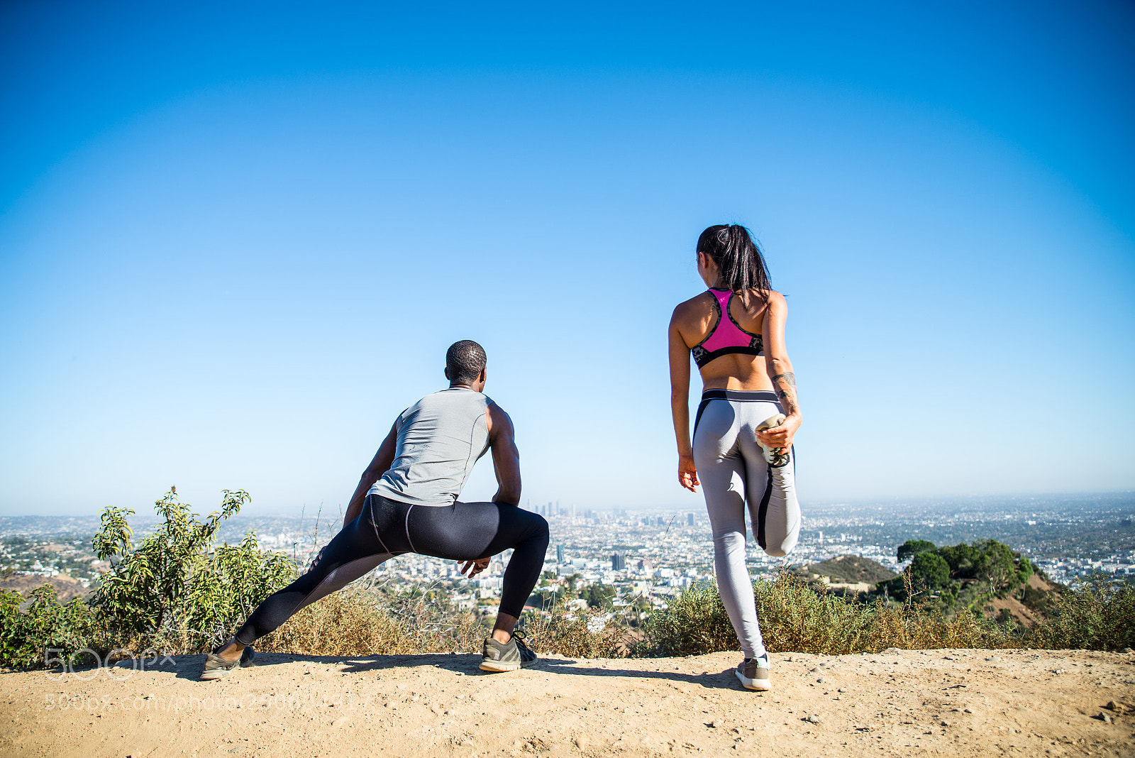Nikon D610 sample photo. Runners doing stretching photography
