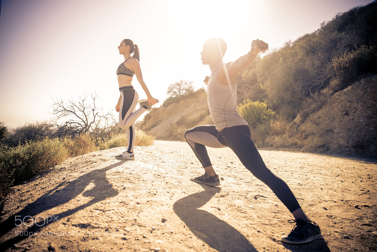 Nikon D610 sample photo. Runners doing stretching photography