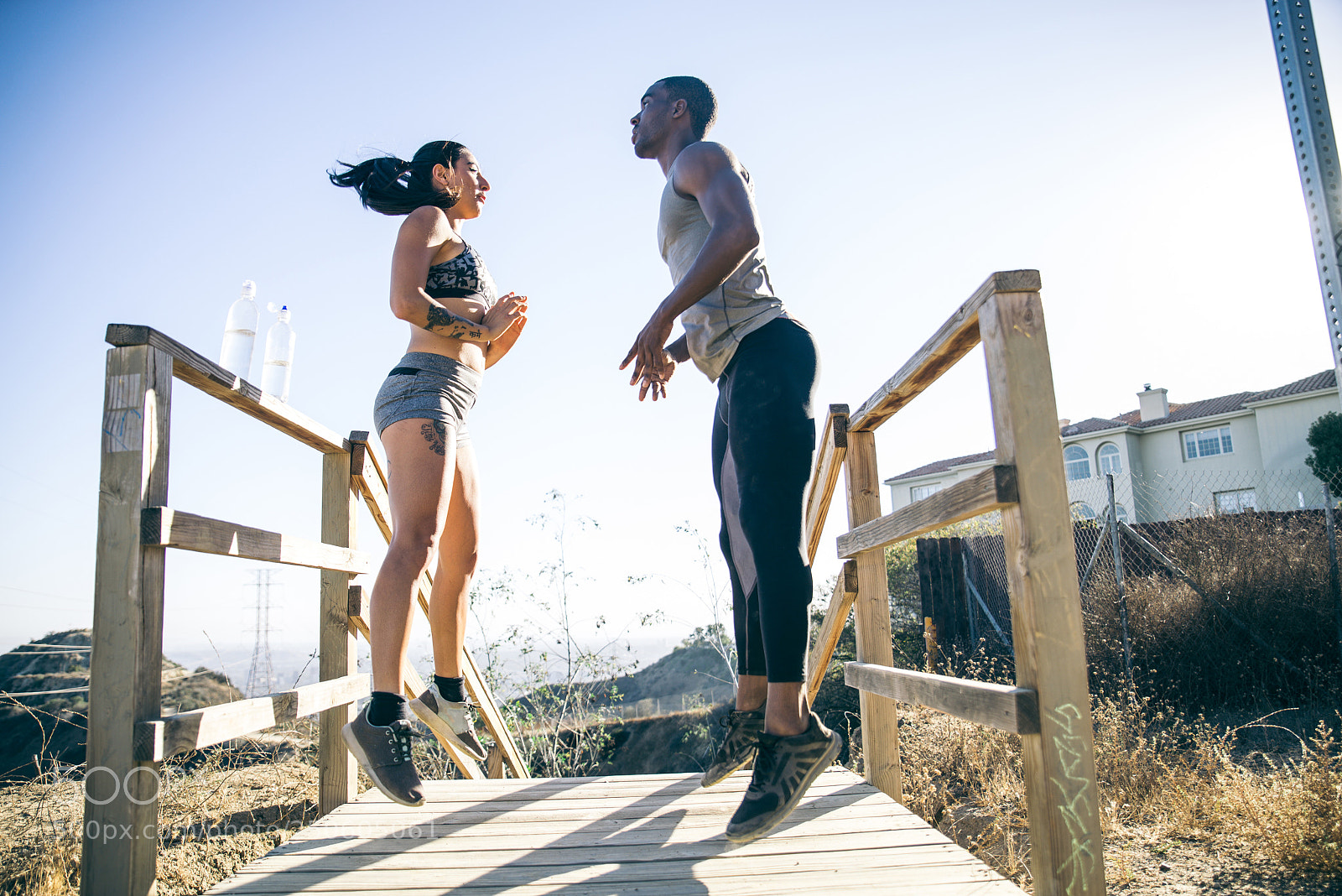Nikon D610 sample photo. Runners jumping photography
