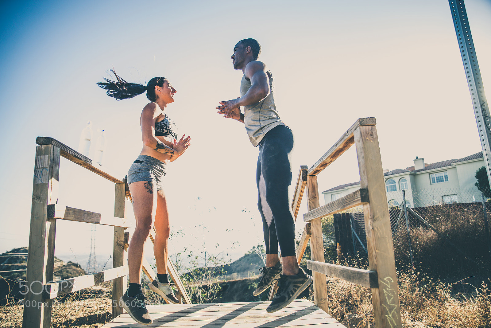 Nikon D610 sample photo. Runners jumping photography