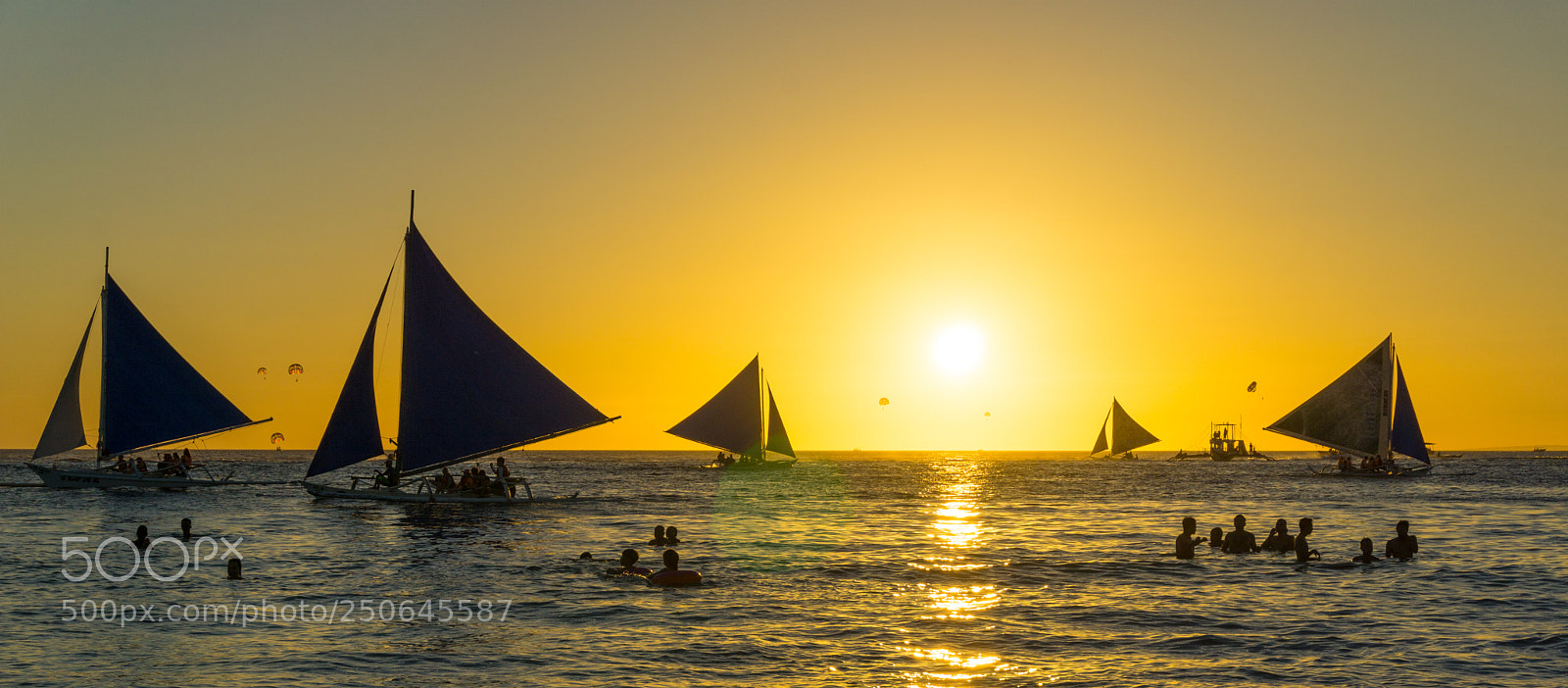 Sony a5100 sample photo. Sailboats at sunset in photography