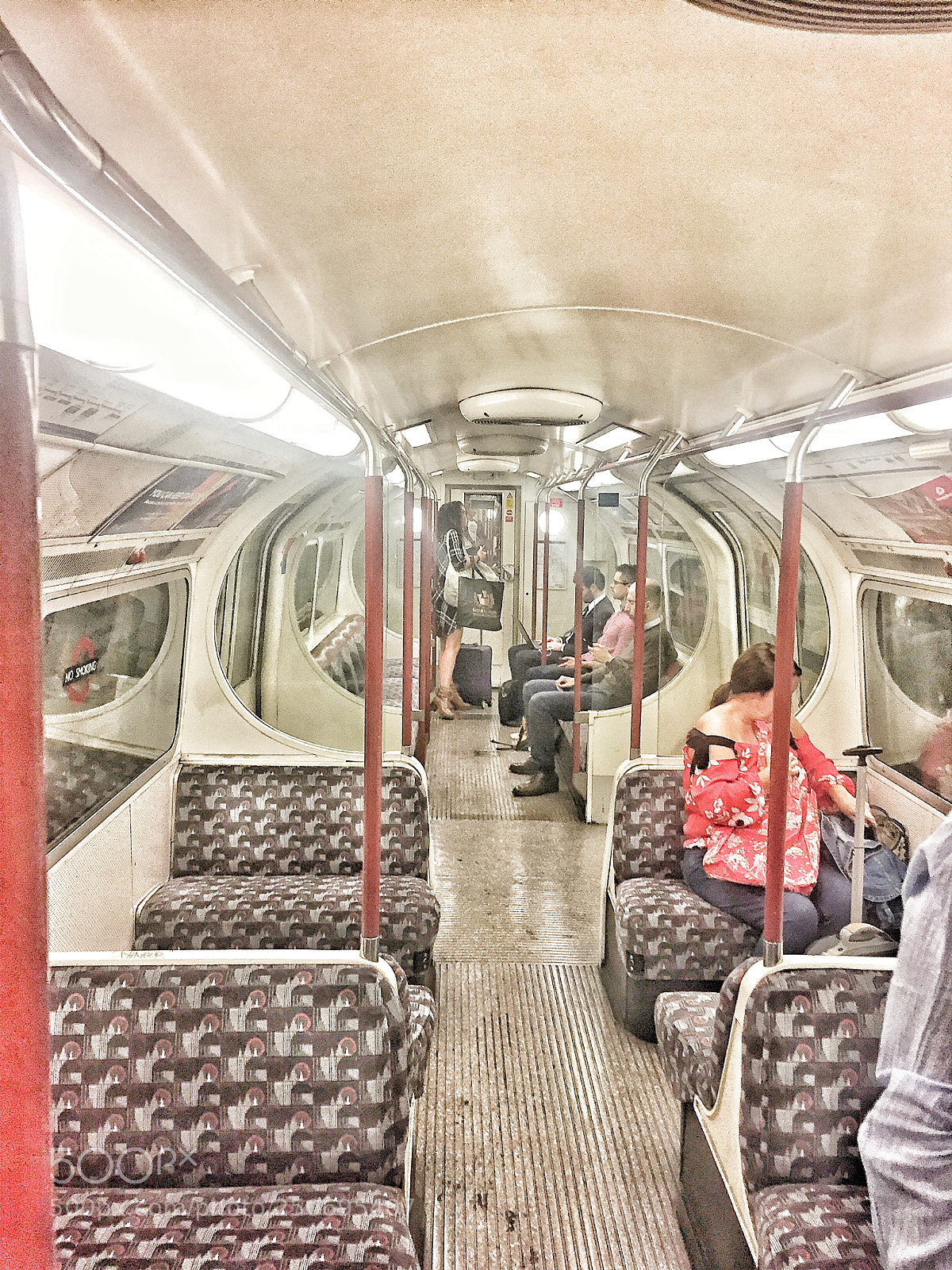 Apple iPhone 6 sample photo. Underground travelers, london. uk. photography