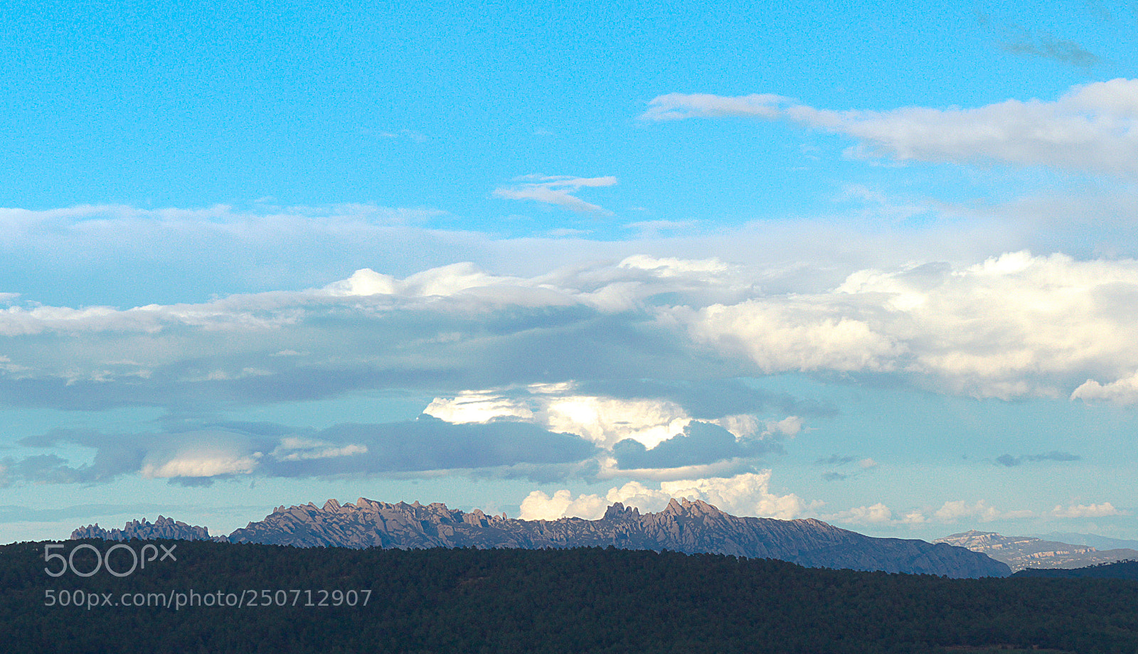 Panasonic Lumix DMC-FZ200 sample photo. Clouds over montserrat photography
