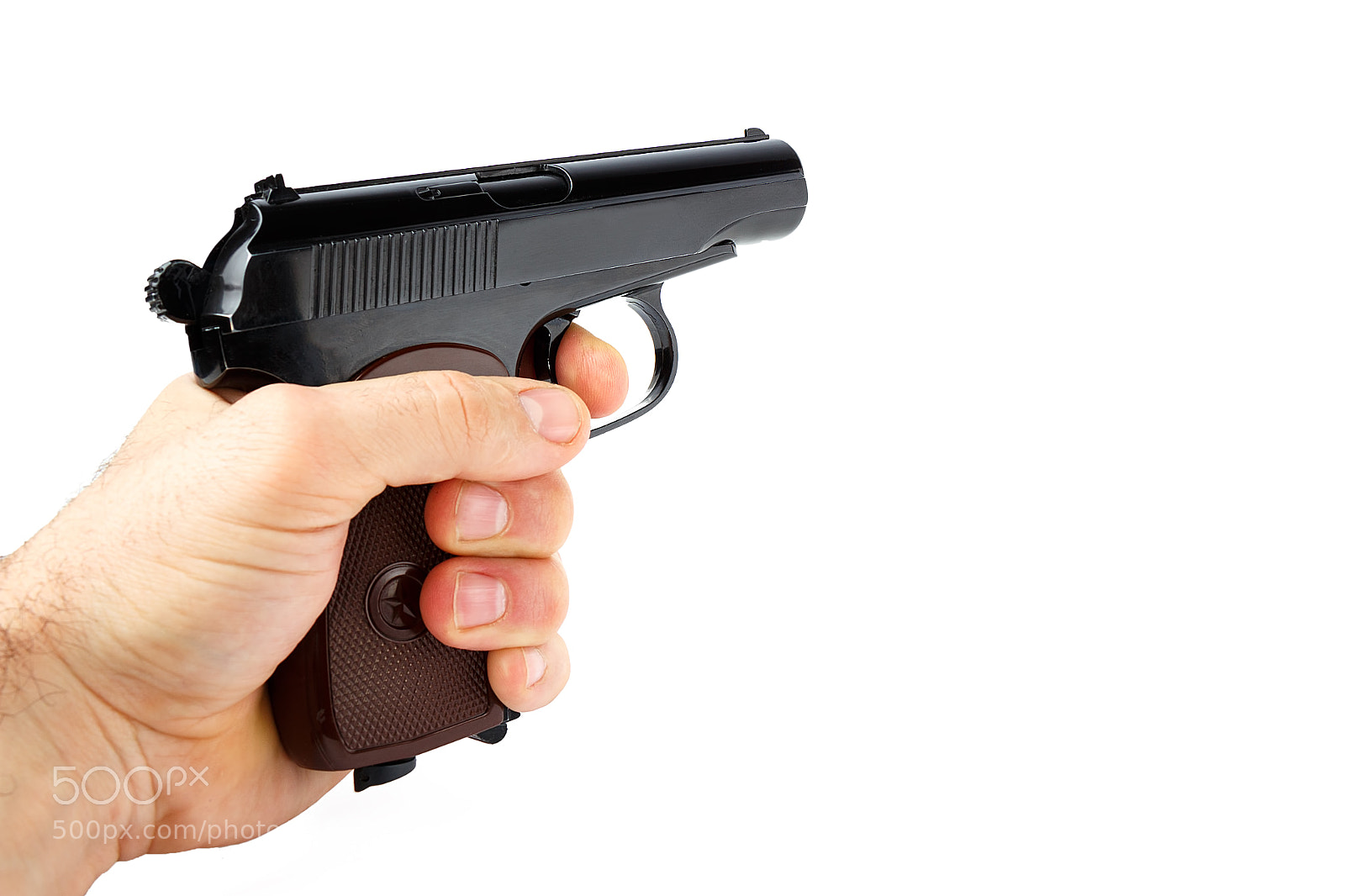 Canon EOS 700D (EOS Rebel T5i / EOS Kiss X7i) sample photo. Hand holds a gun photography