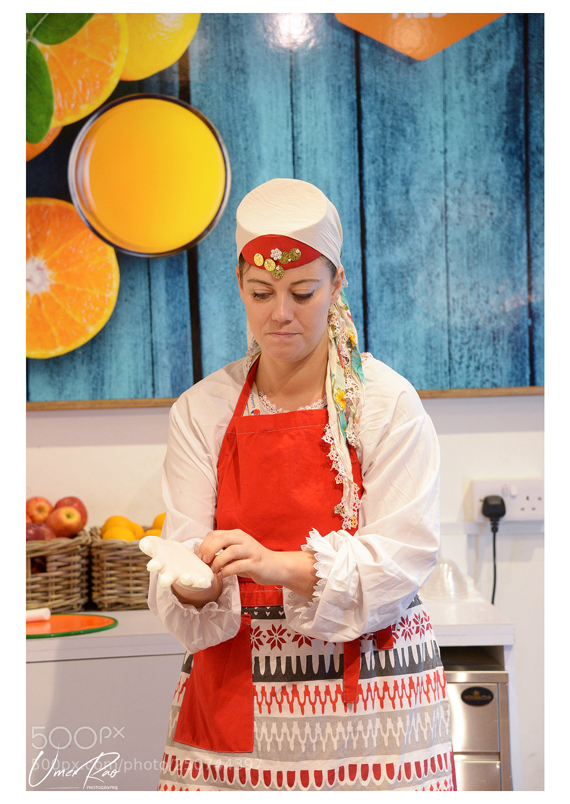 Nikon D610 sample photo. Woman at a stall photography