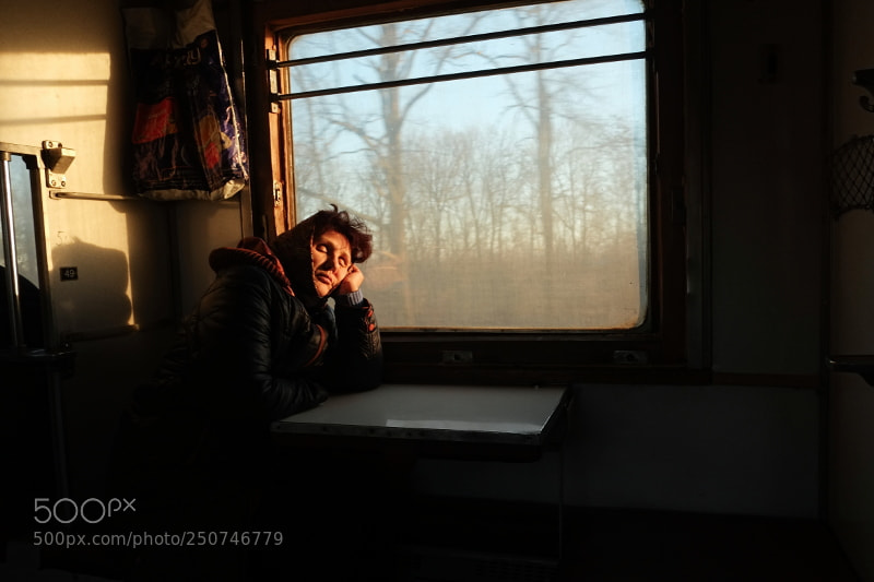 Fujifilm X-Pro1 sample photo. Woman in the train photography