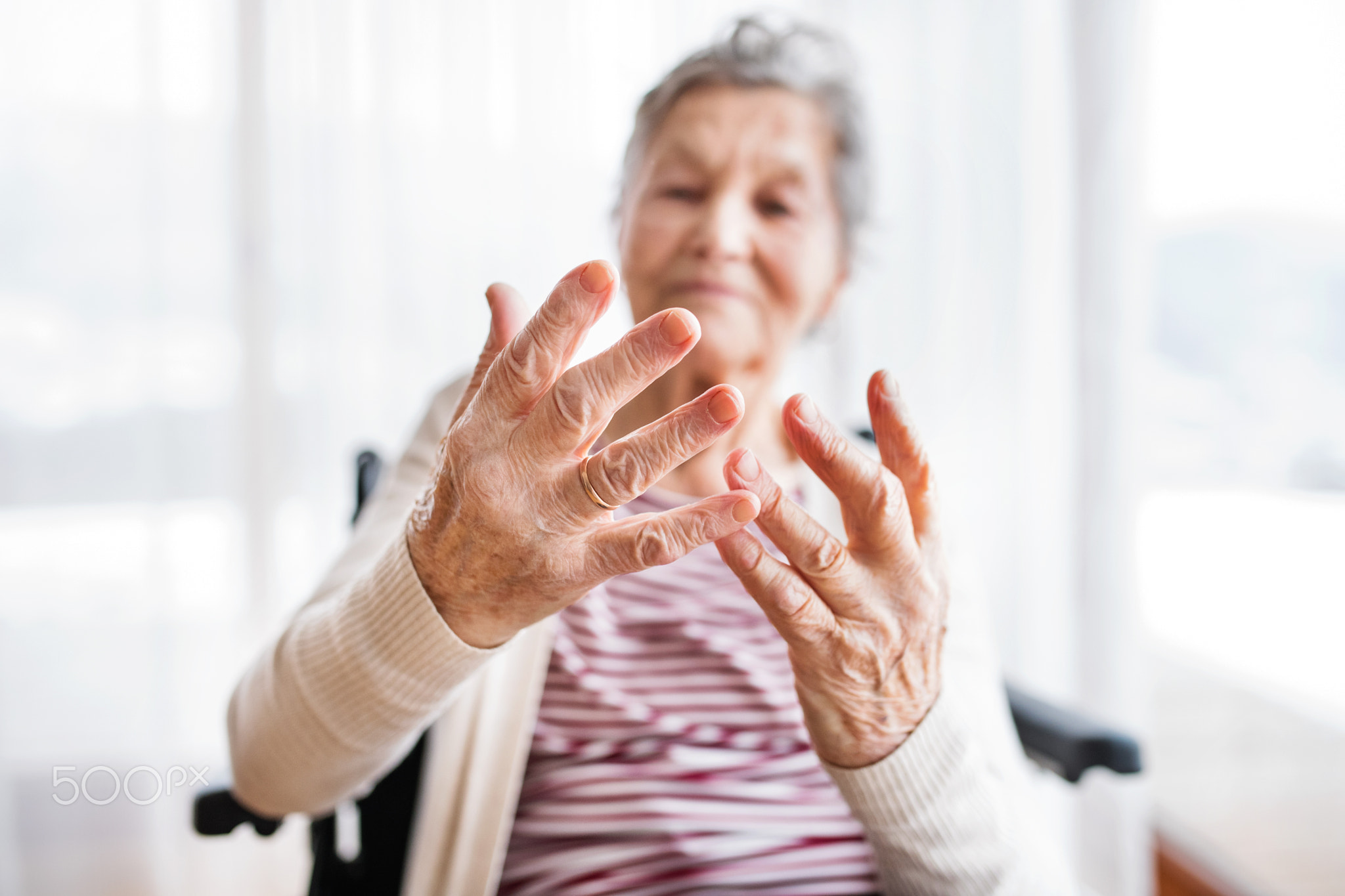 Senior woman in wheelchair at home.