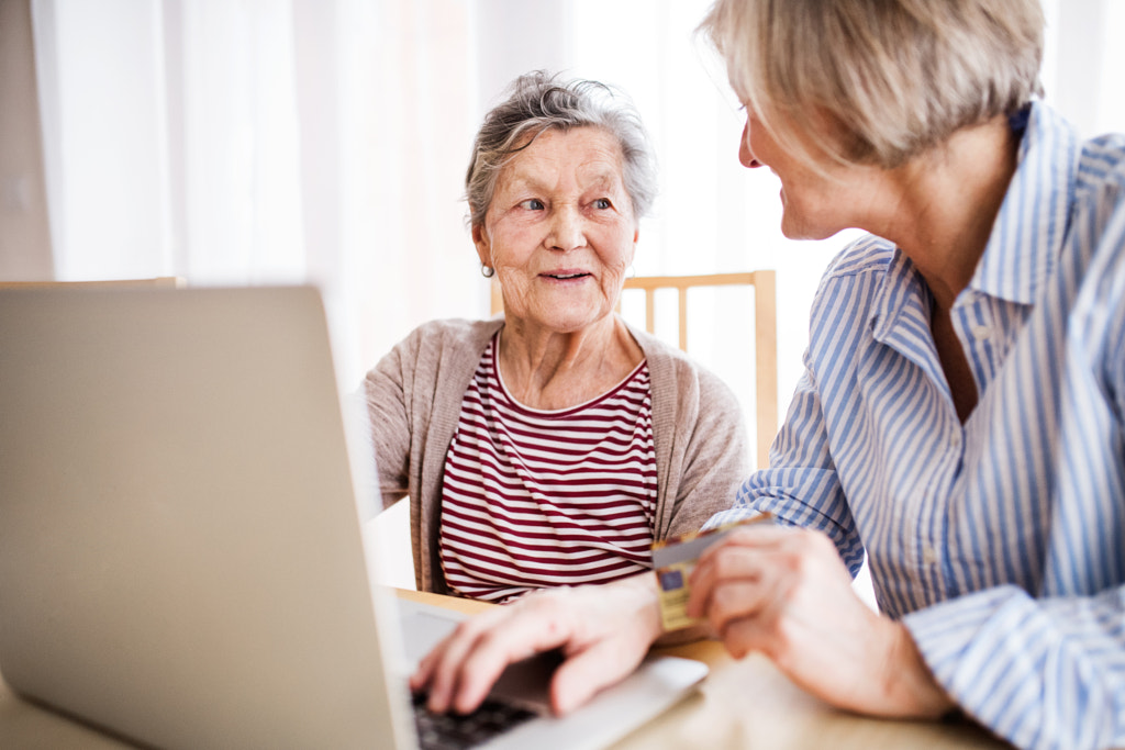 Senior woman with her mother with laptop at home. by Jozef Polc on 500px.com