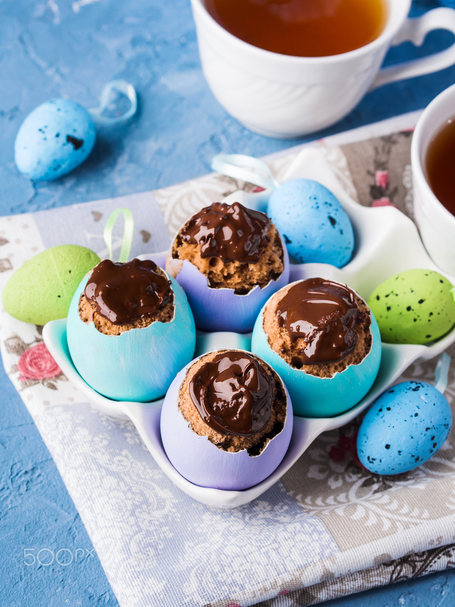 Easter background with cakes in eggs