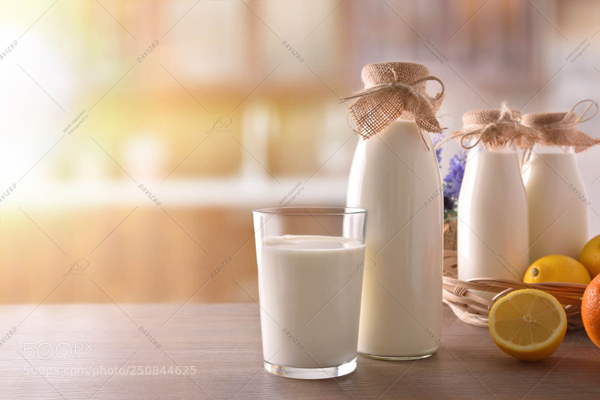 Nikon D810 sample photo. Milk containers on wooden photography
