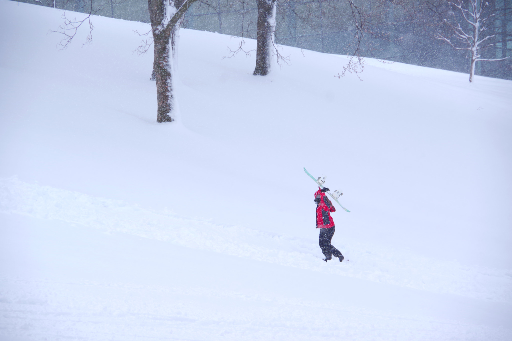 Pentax K-70 sample photo. Snowboarder hiking up empac hill photography
