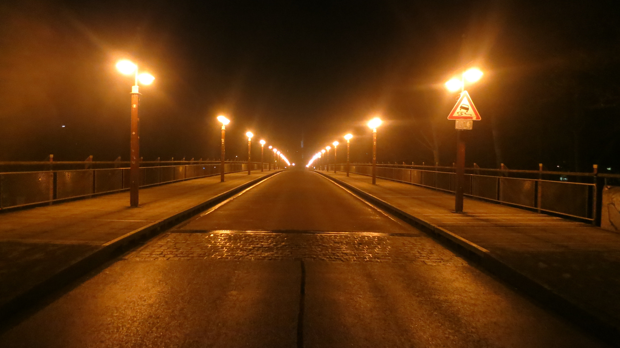 Canon PowerShot S100 sample photo. Munich at night: empty bridge across the river isar photography
