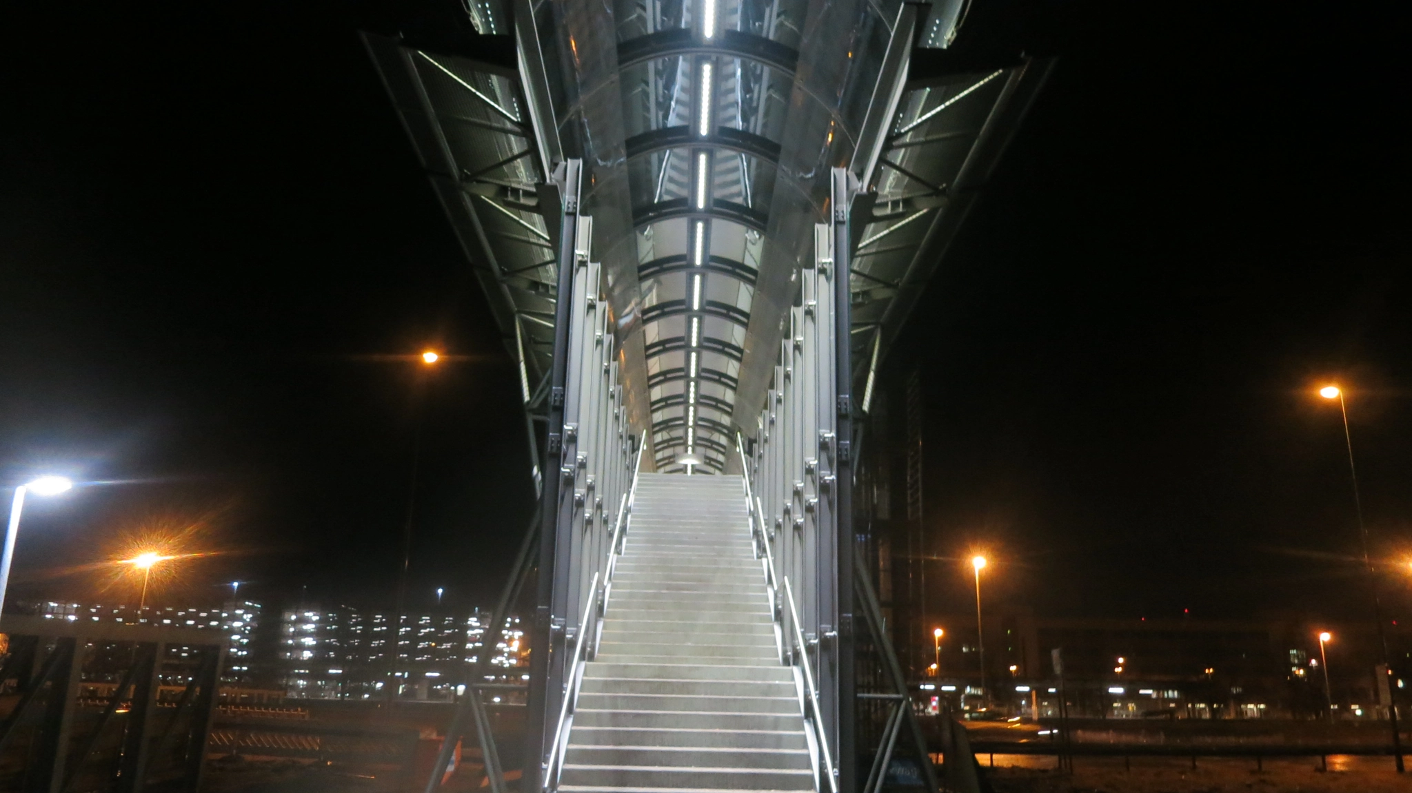 Canon PowerShot S100 sample photo. Munich at night: stairs to a pedestrian bridge at the airport. photography