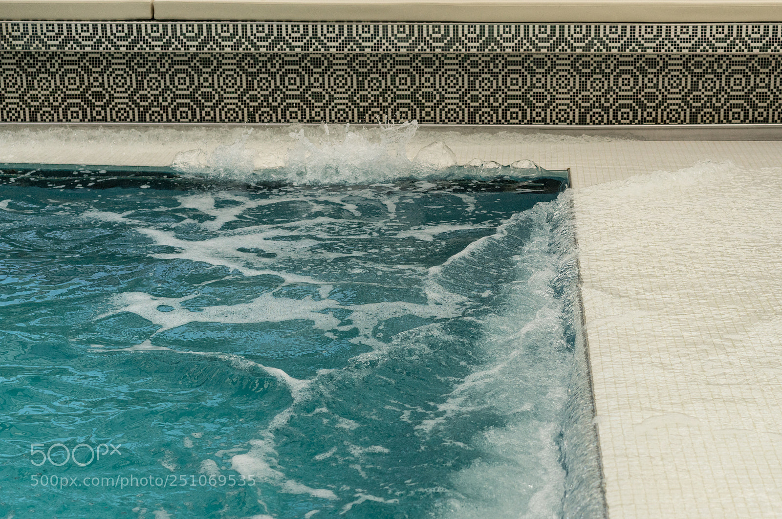 Sony a7R III sample photo. Water sloshing around tiled photography