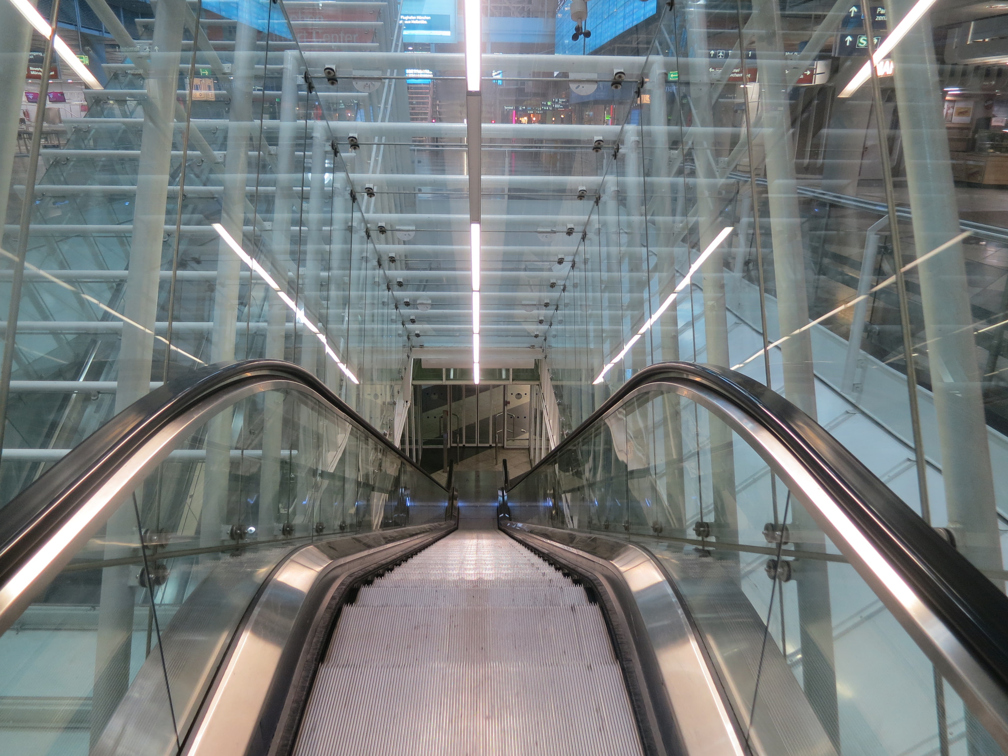 Canon PowerShot S100 sample photo. Munich at nught: premium escalator at the airport. photography