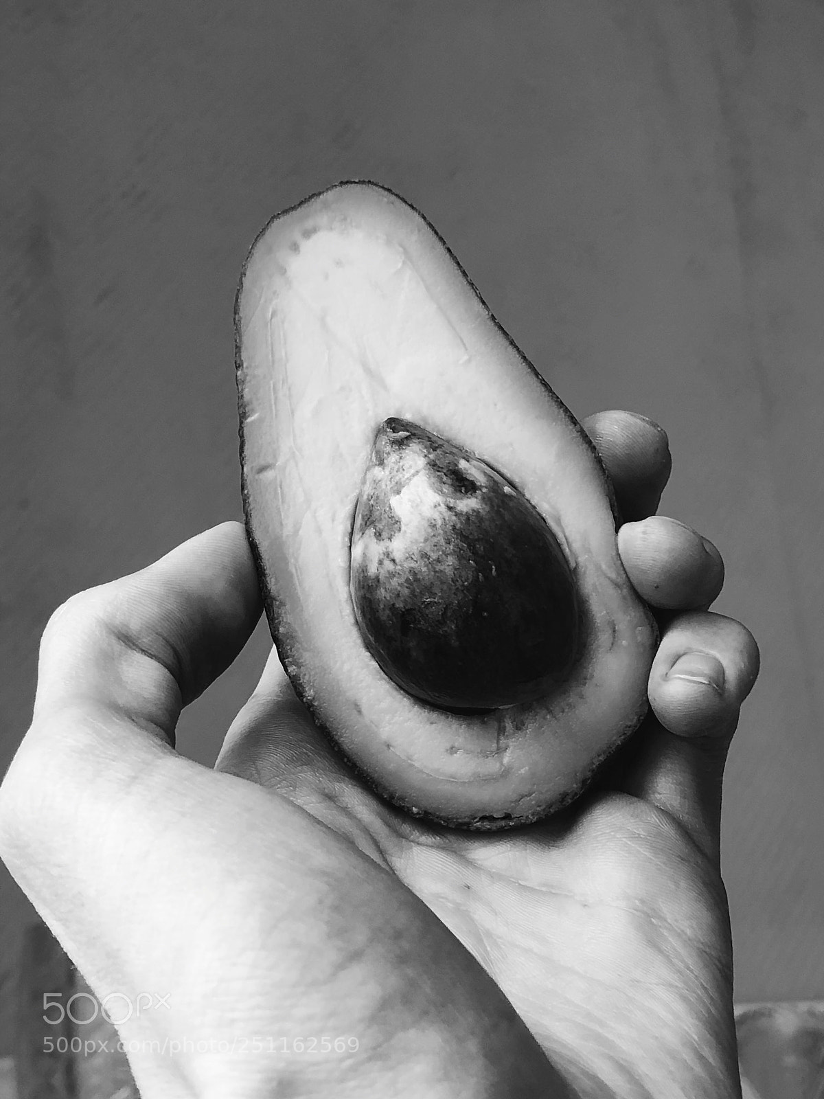Apple iPhone X sample photo. Avocado in the hand photography