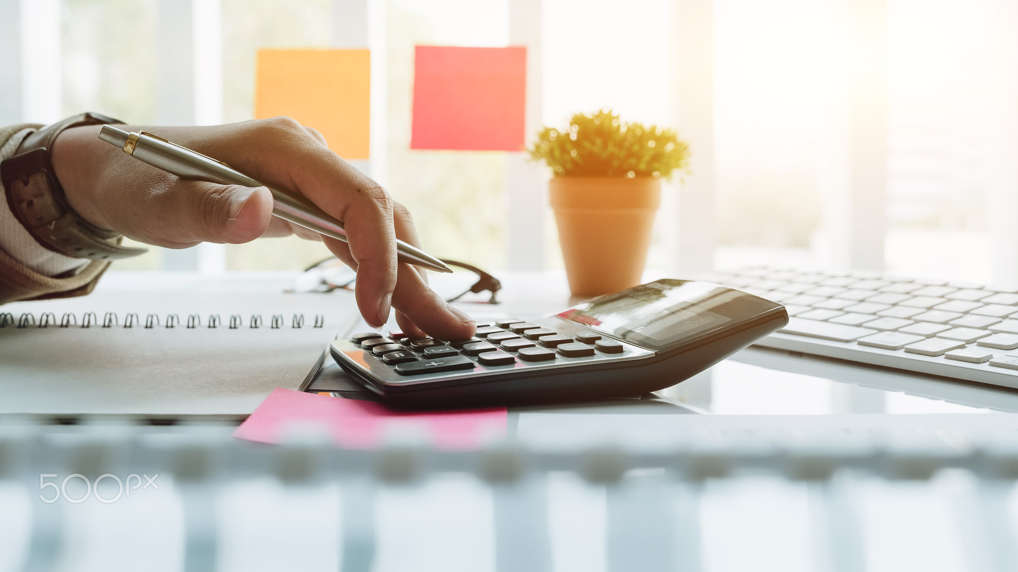 Close up view of bookkeeper or financial inspector hands making