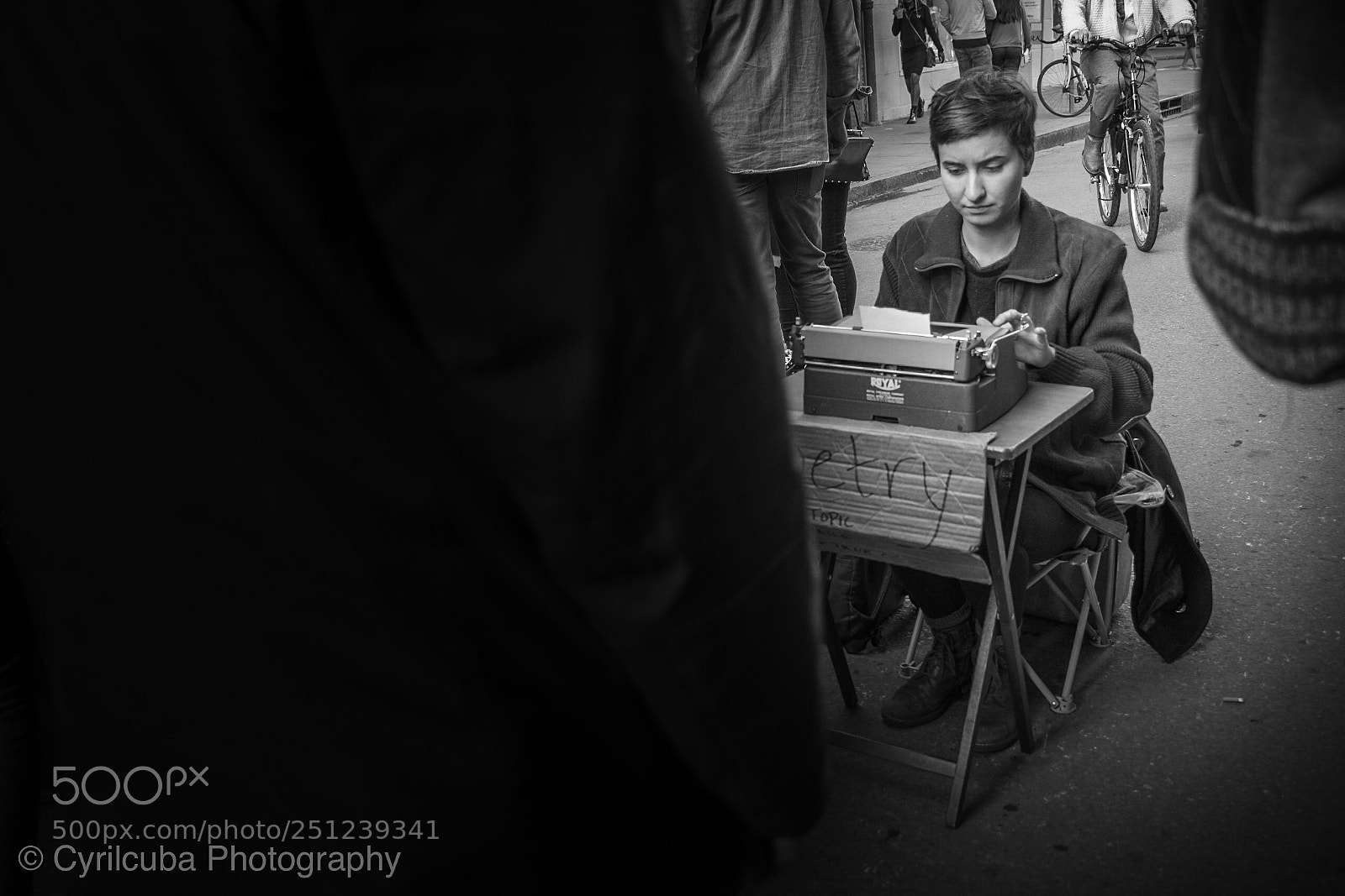 Nikon D5500 sample photo. Writer among people walking photography