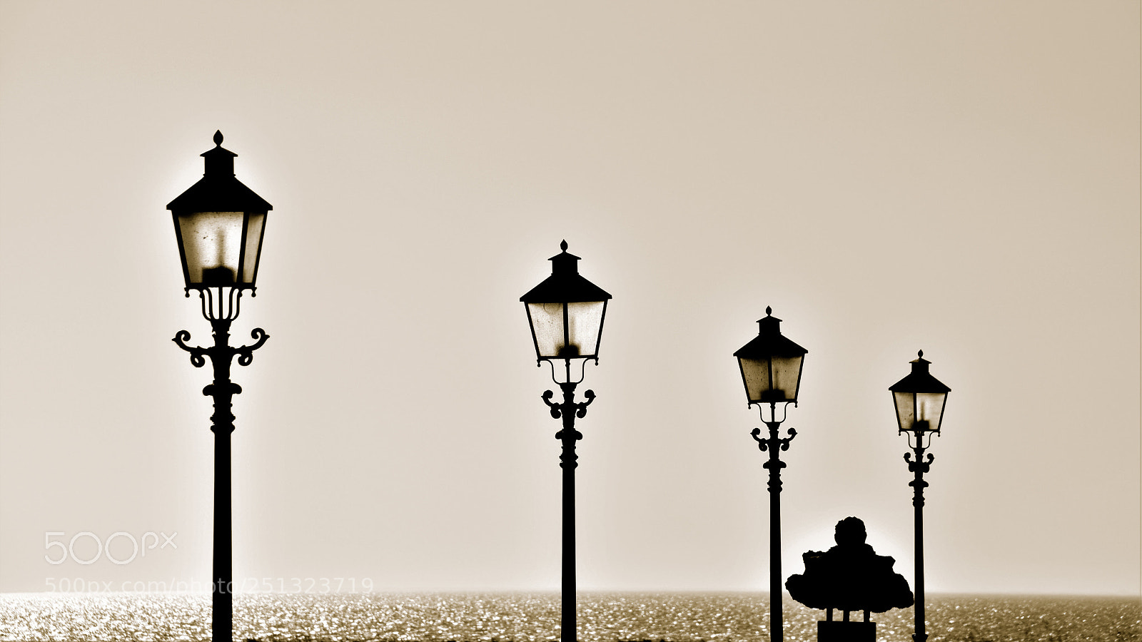 Nikon D3300 sample photo. 4 lampposts and a statue photography